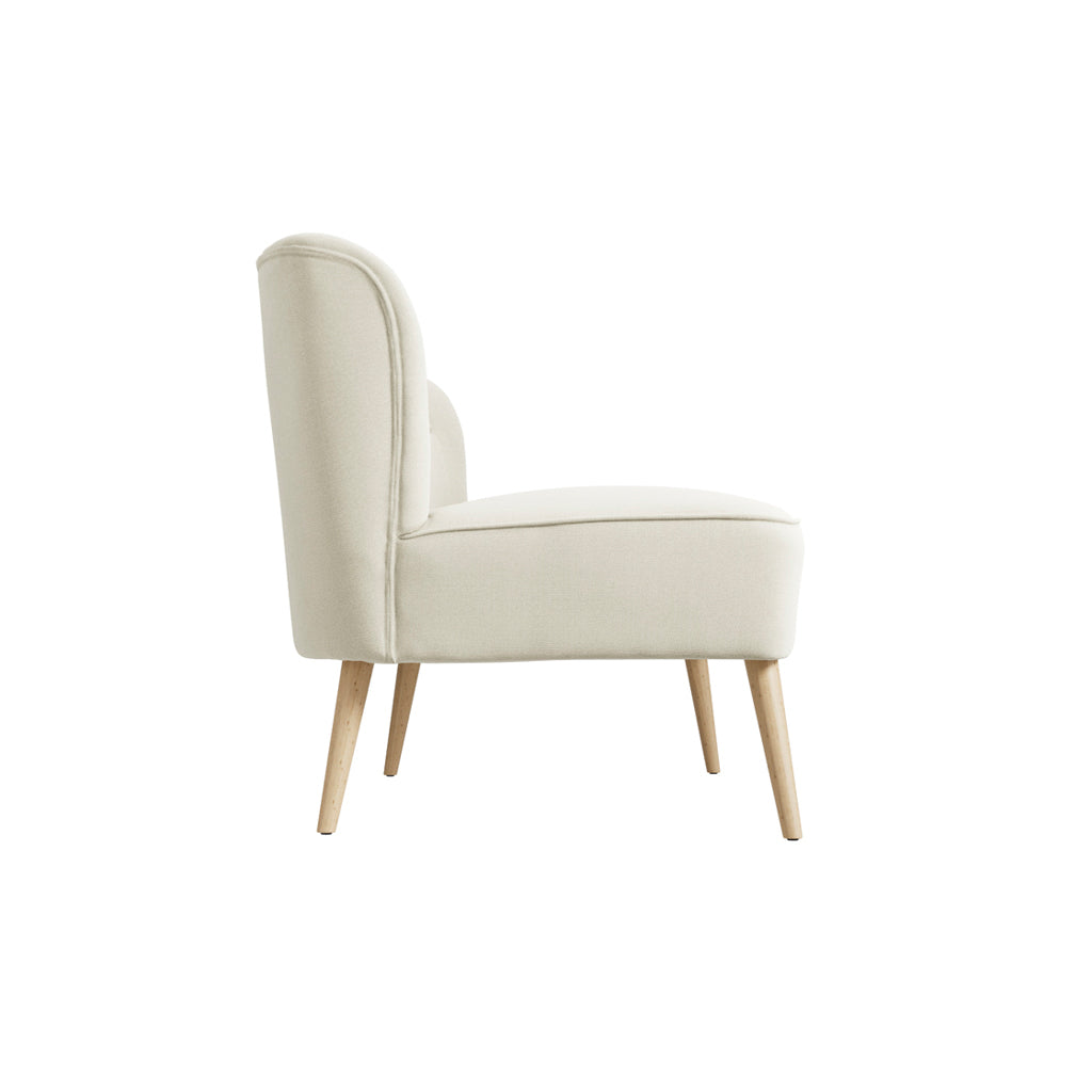 LPD Furniture Beau Sand 2 seater sofa with tufted back and blonde wood legs in a modern living room setting