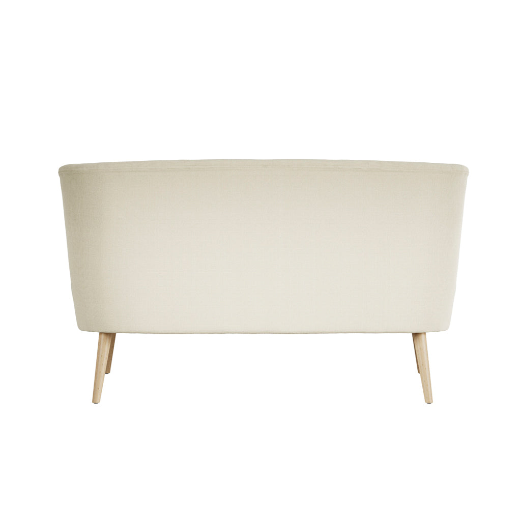 LPD Furniture Beau Sand 2 seater sofa with tufted back and blonde wood legs in a modern living room setting