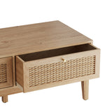 LPD Furniture Bordeaux oak coffee table with rattan front and gold fittings in a modern living room setting