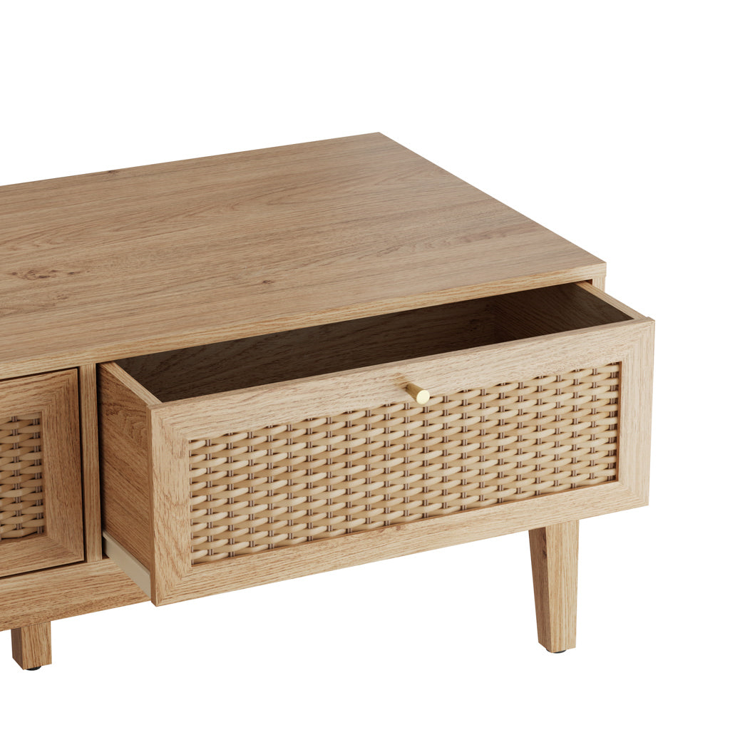 LPD Furniture Bordeaux oak coffee table with rattan front and gold fittings in a modern living room setting