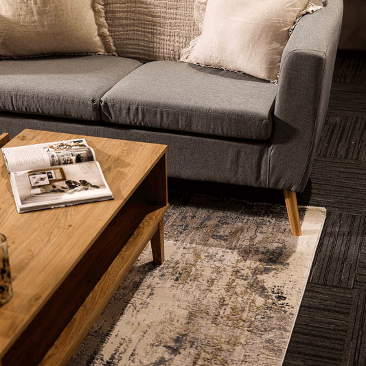 LPD Furniture Bordeaux oak coffee table with rattan front and gold fittings in a modern living room setting