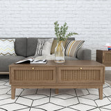 LPD Furniture Bordeaux oak coffee table with rattan front and gold fittings in a modern living room setting