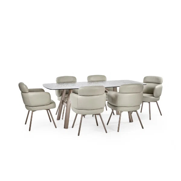 Callisto smoked bubble glass dining table with brushed bronze legs in a modern dining room setting