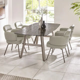 Callisto smoked bubble glass dining table with brushed bronze legs in a modern dining room setting