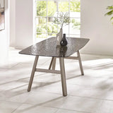 Callisto smoked bubble glass dining table with brushed bronze legs in a modern dining room setting
