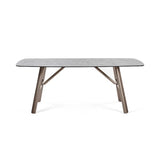 Callisto smoked bubble glass dining table with brushed bronze legs in a modern dining room setting