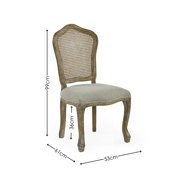 Camille set of 2 rattan dining chairs with handwoven backrest and beige linen seats in a modern dining room