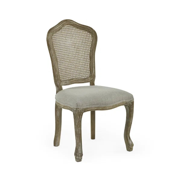 Camille set of 2 rattan dining chairs with handwoven backrest and beige linen seats in a modern dining room