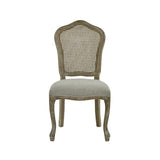 Camille set of 2 rattan dining chairs with handwoven backrest and beige linen seats in a modern dining room