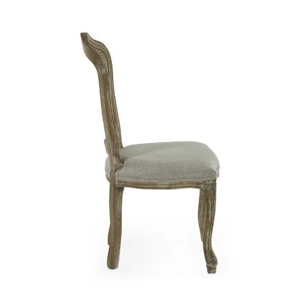 Camille set of 2 rattan dining chairs with handwoven backrest and beige linen seats in a modern dining room
