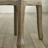 Camille set of 2 rattan dining chairs with handwoven backrest and beige linen seats in a modern dining room