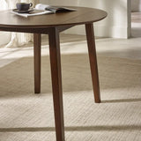 Julian Bowen Coast walnut drop leaf dining table in a modern compact dining setting
