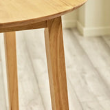 	Julian Bowen Coast natural oak drop leaf dining table in a modern compact dining setting