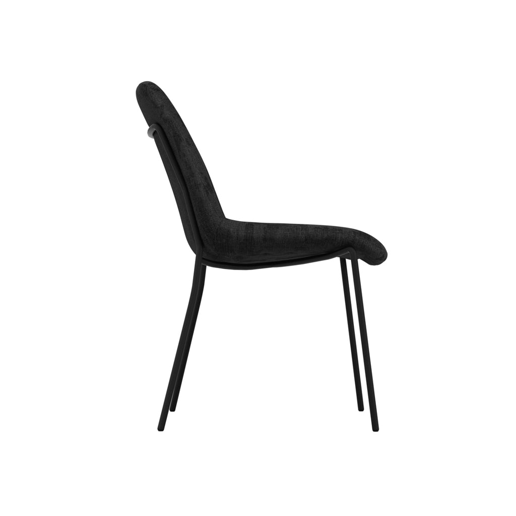 LPD Furniture Carlo black textured velvet dining chair with curved metal back in a modern dining setting