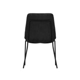 LPD Furniture Carlo black textured velvet dining chair with curved metal back in a modern dining setting