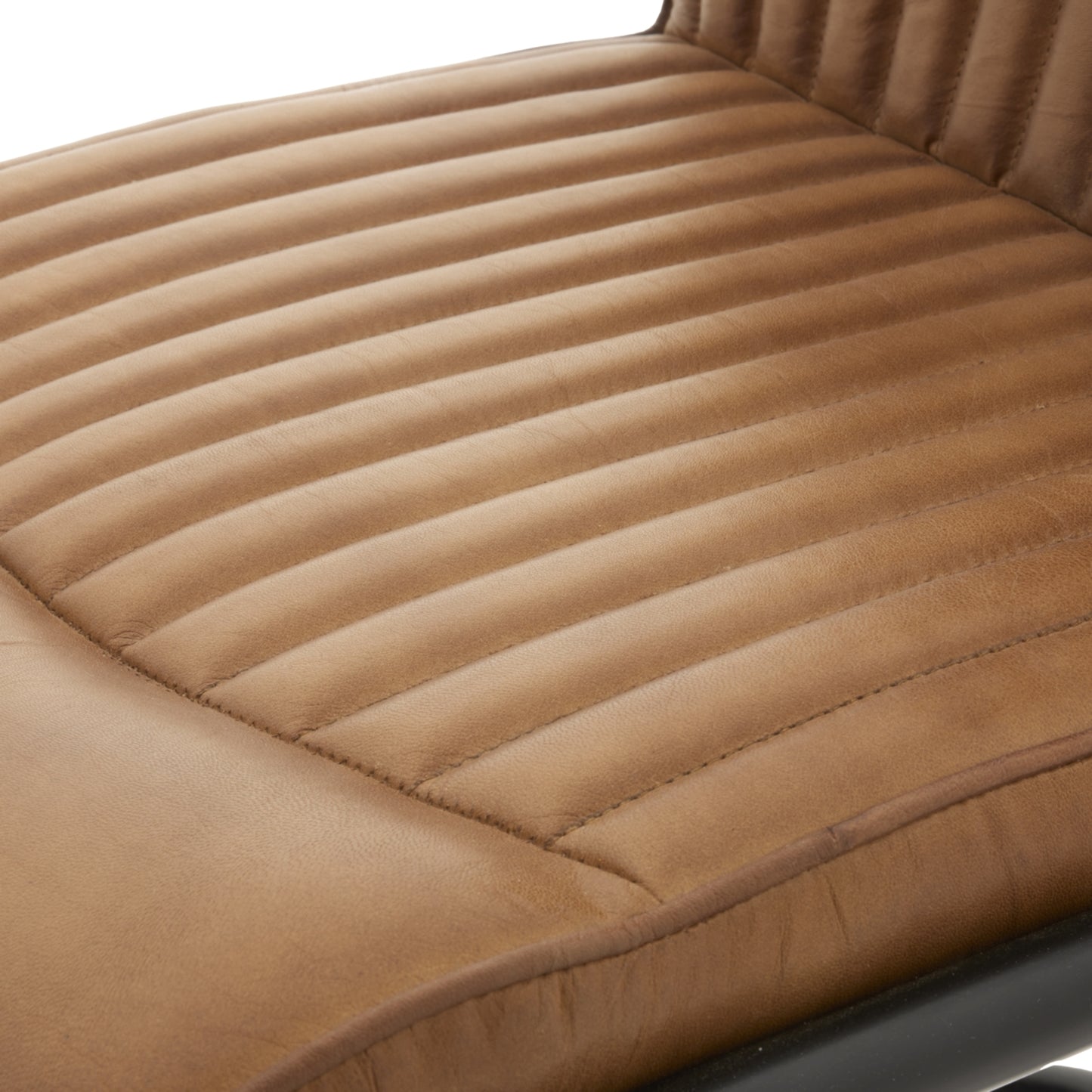 Close-up of Hill Interiors Billy leather dining chair showcasing the premium leather texture and vertical channeling