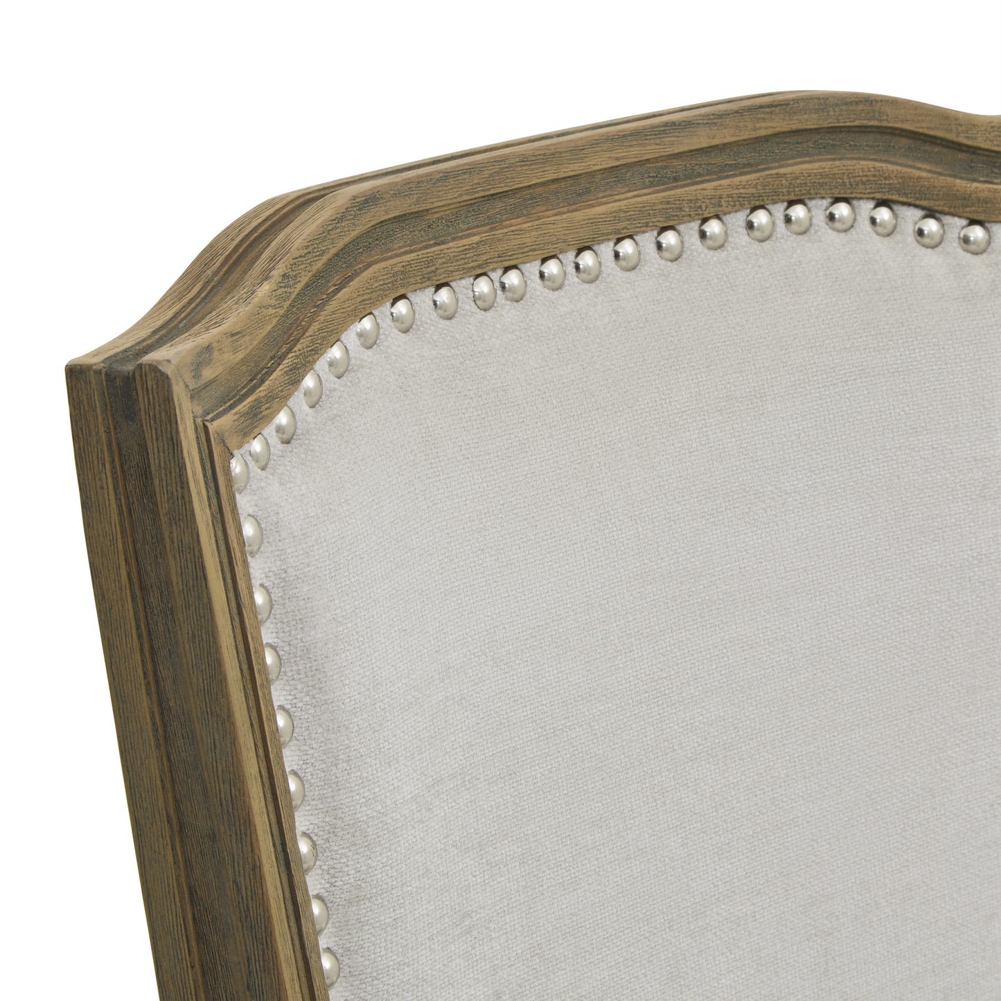 Close-up of Hill Interiors Ripley grey dining chair showcasing the hand-carved wooden frame detail