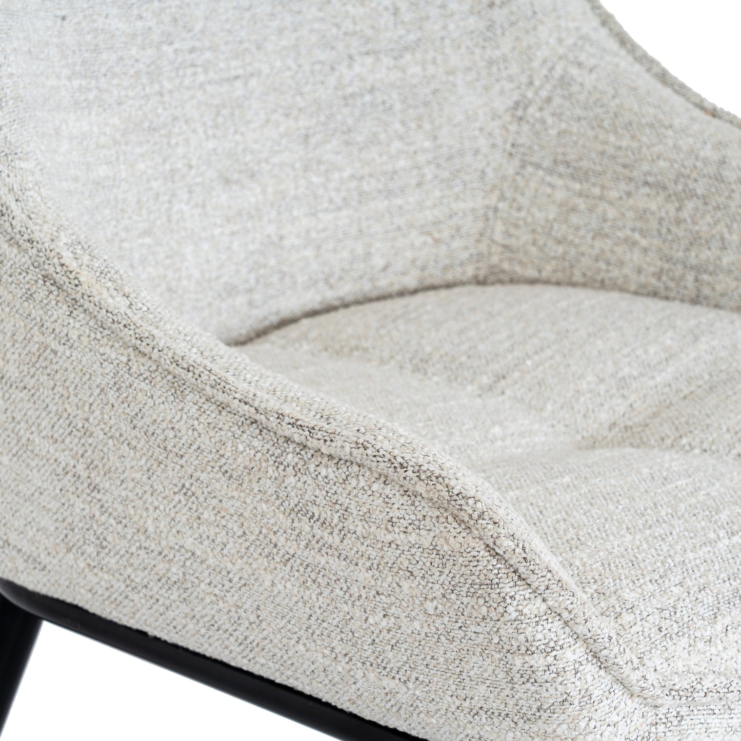	Close-up of Hill Interiors Zephra white dining chair showcasing the fabric texture and stitching details