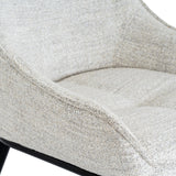 	Close-up of Hill Interiors Zephra white dining chair showcasing the fabric texture and stitching details
