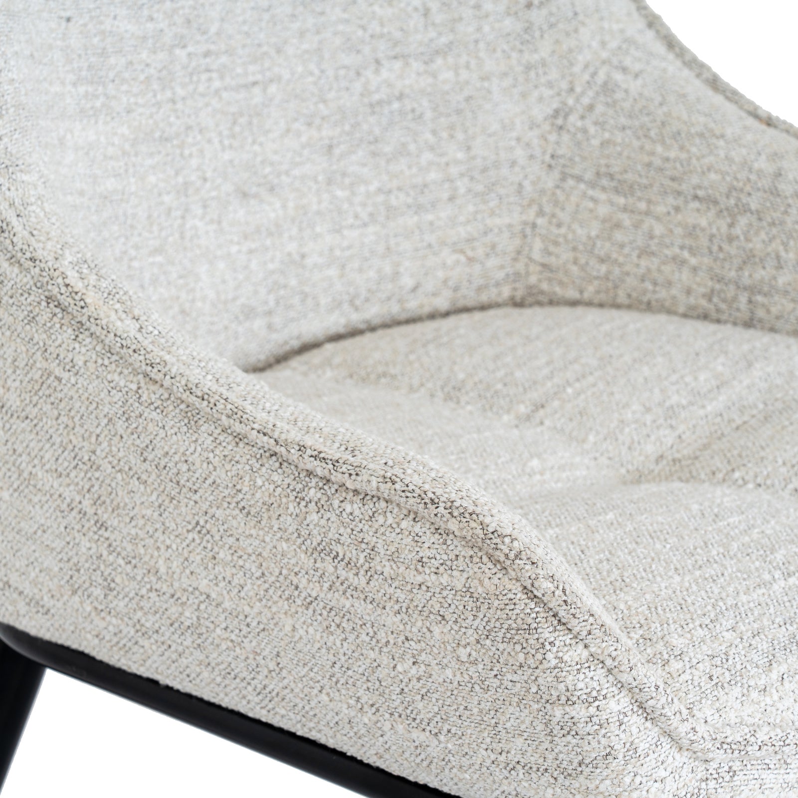 	Close-up of Hill Interiors Zephra white dining chair showcasing the fabric texture and stitching details