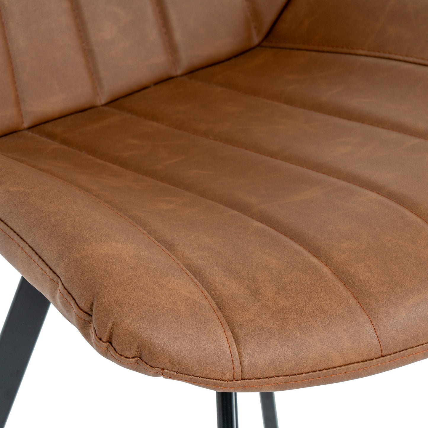 Close-up of Hill Interiors Cobham grey dining chair upholstery texture and antique brass stud detailing