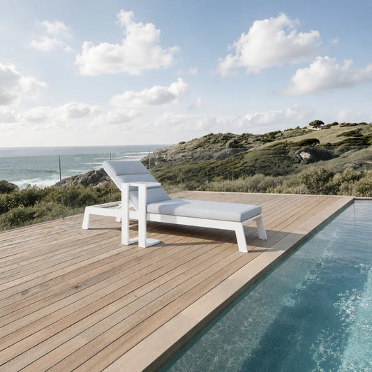 ALUXO Dasia white reclining sun lounger with matching side table in a modern garden setting