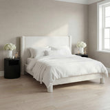 LPD Furniture Dena snow white upholstered bed in a modern bedroom setting