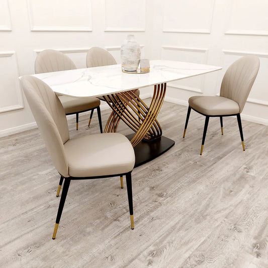 Furnish365 Etta dining chair in soft neutral fabric with curved backrest and gold-tipped legs in a contemporary dining setting