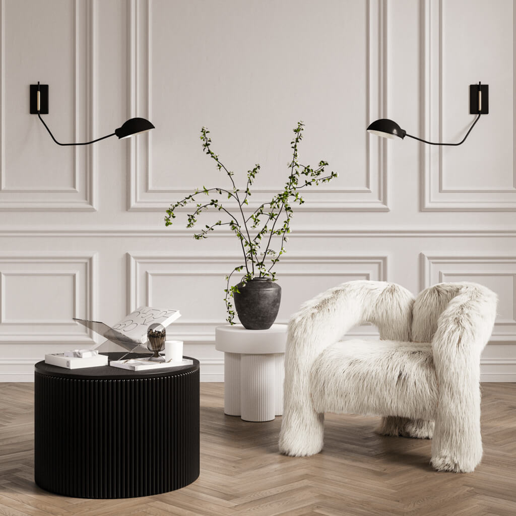 LPD Furniture Eden round black coffee table with textured top and ribbed base in a modern living room setting
