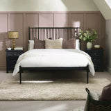 Floyd black metal spindle bed in a modern bedroom setting