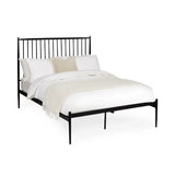 Floyd black metal spindle bed in a modern bedroom setting