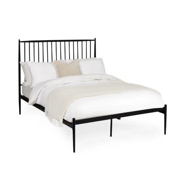 Floyd black metal spindle bed in a modern bedroom setting