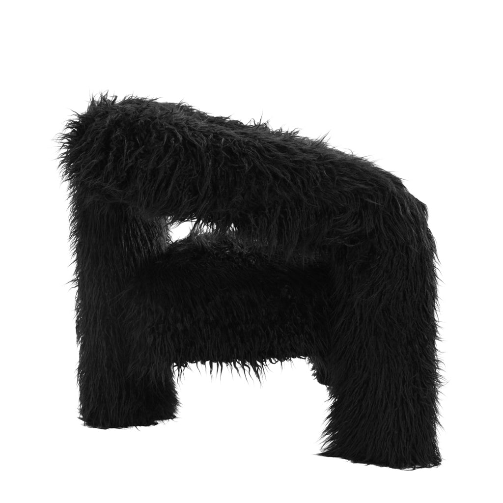 LPD Furniture Freyja jet black faux Mongolian fur extra-large accent chair with curved three-leg base in a modern living room setting