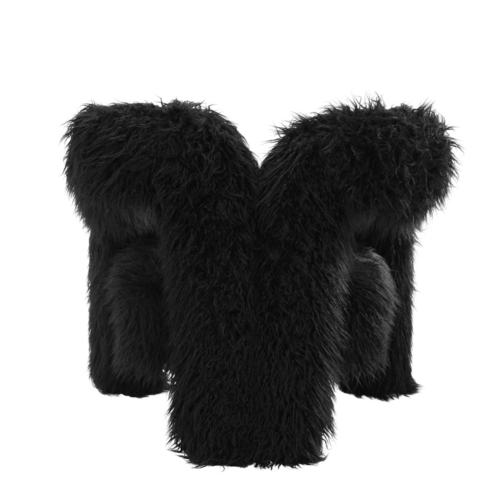 LPD Furniture Freyja jet black faux Mongolian fur extra-large accent chair with curved three-leg base in a modern living room setting