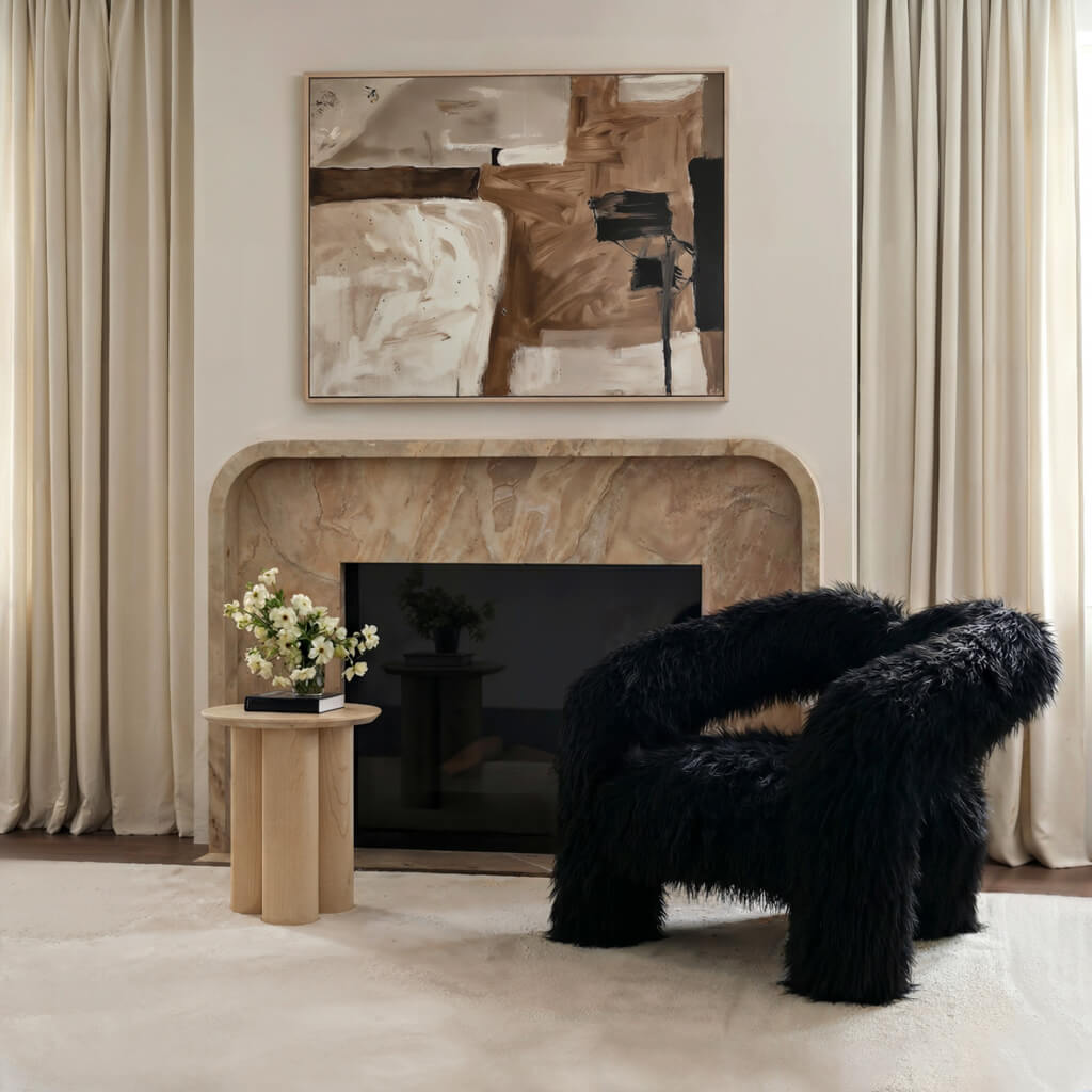 LPD Furniture Freyja jet black faux Mongolian fur extra-large accent chair with curved three-leg base in a modern living room setting