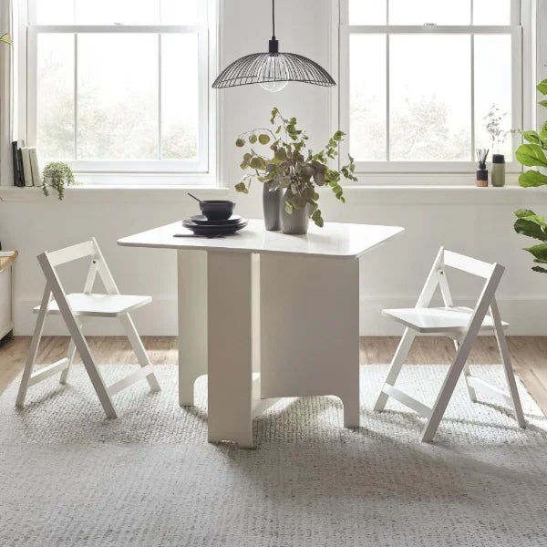 Gatan white gateleg table with 2 chairs in a compact kitchen or dining setting