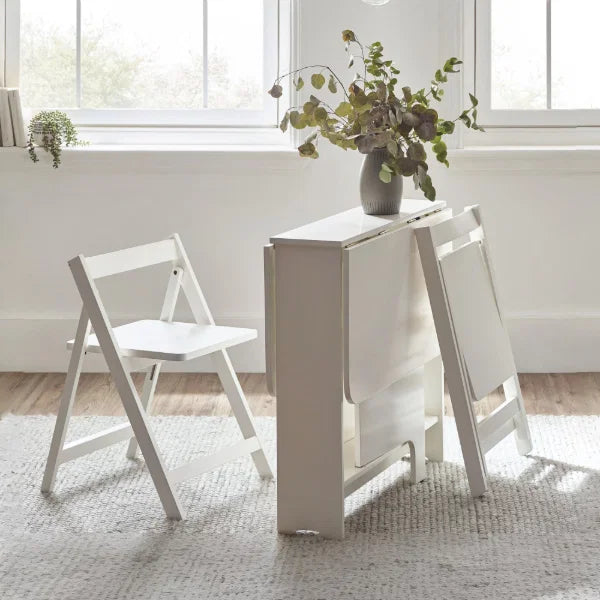 Gatan white gateleg table with 2 chairs in a compact kitchen or dining setting