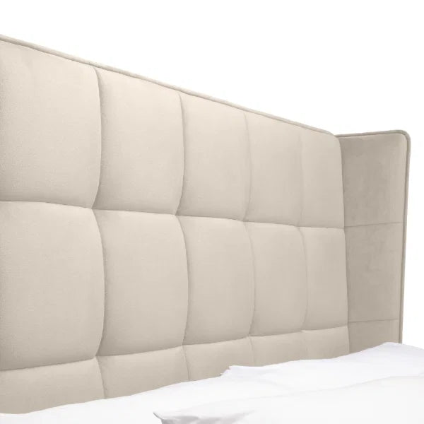 Gatsby cream velvet ottoman bed with tall winged headboard in a modern bedroom setting
