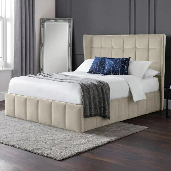 Gatsby cream velvet ottoman bed with tall winged headboard in a modern bedroom setting