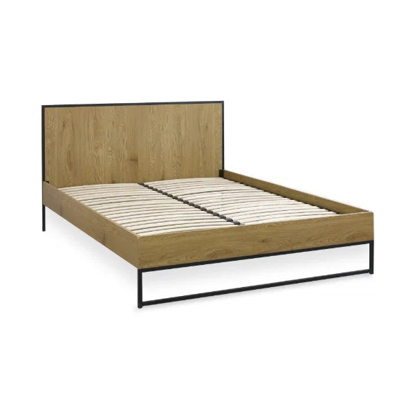 Harlow oak-effect double bed frame with black metal frame in a modern bedroom setting
