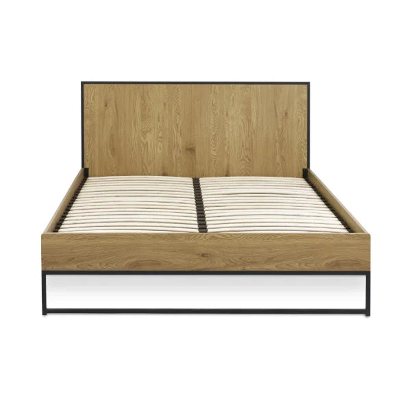 Harlow oak-effect double bed frame with black metal frame in a modern bedroom setting