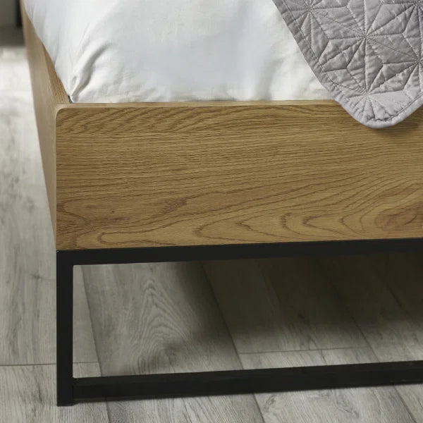Harlow oak-effect double bed frame with black metal frame in a modern bedroom setting