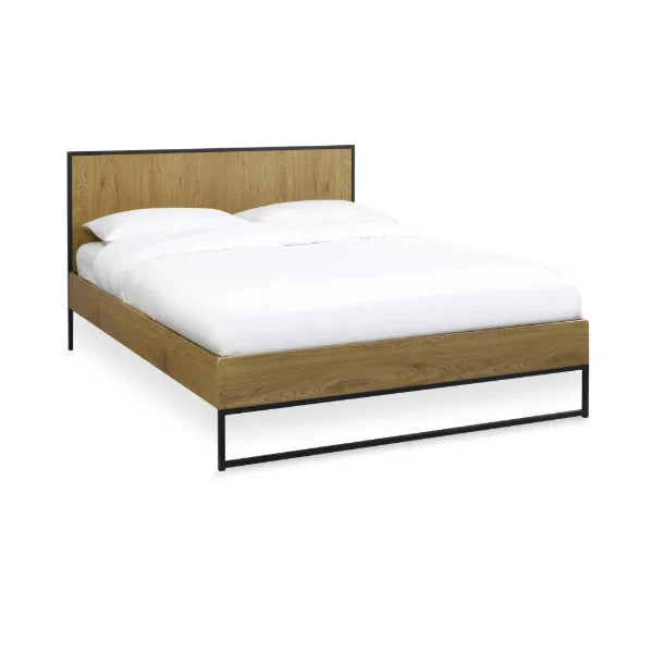 Harlow oak-effect king bed frame with black metal frame in a modern bedroom setting