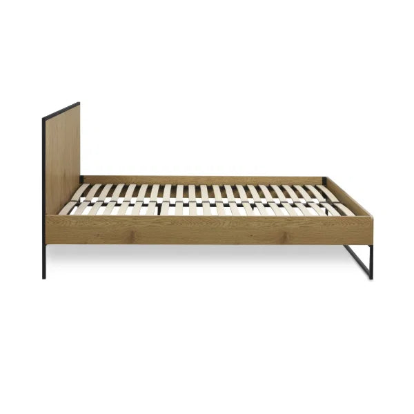 Harlow oak-effect king bed frame with black metal frame in a modern bedroom setting