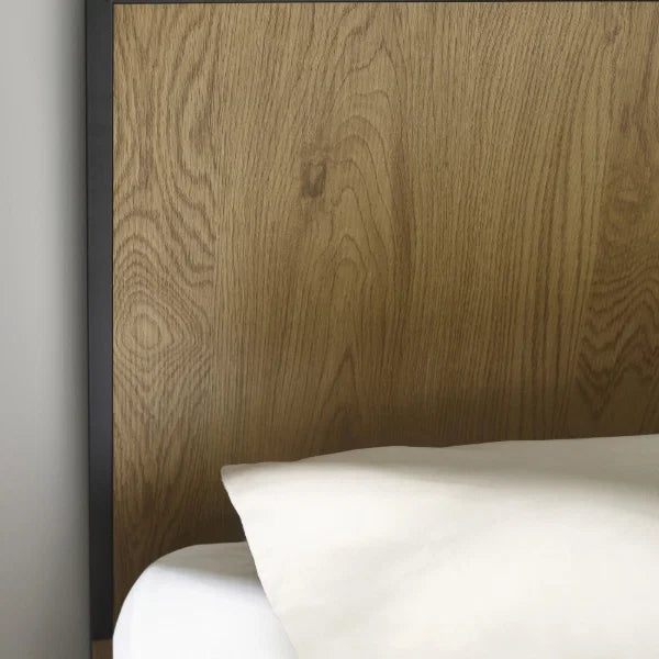 Harlow oak-effect king bed frame with black metal frame in a modern bedroom setting