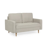 Henrietta beige 2 seater sofa with tufted seat cushions in a modern living room setting