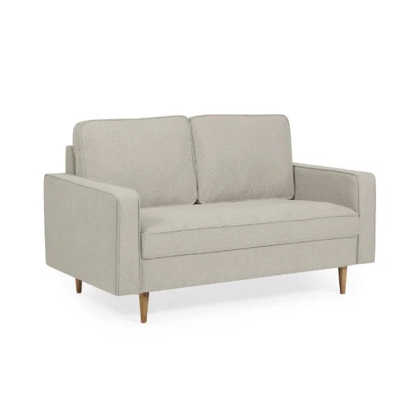 Henrietta beige 2 seater sofa with tufted seat cushions in a modern living room setting