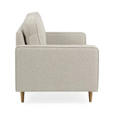 Henrietta beige 2 seater sofa with tufted seat cushions in a modern living room setting