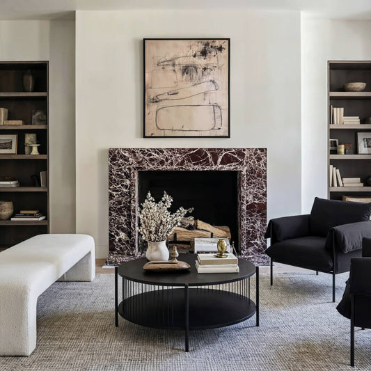 LPD Furniture Harper black matte coffee table with curved design and hidden storage in a modern living room setting