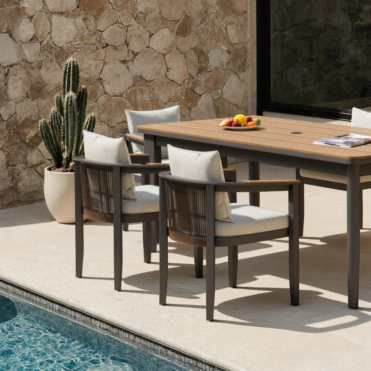 Furnish365 Hemera 6 seater outdoor dining set with PS slatted wood table and aluminium frame in a modern garden setting